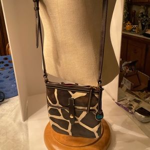 Dooney & Bourke giraffe print vinyl crossover bag.